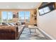 Comfortable living room featuring a large window, hardwood floors, and stylish decor at 8552 W San Juan Ave, Littleton, CO 80128