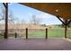Wide, wooden back deck featuring black metal railing with view at 6491 Crestbrook Dr, Morrison, CO 80465