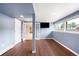 Finished basement space with wood flooring, a full sized window, and a cozy layout at 6491 Crestbrook Dr, Morrison, CO 80465