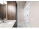 Modern bathroom with walk-in shower and sleek granite vanity at 6491 Crestbrook Dr, Morrison, CO 80465