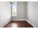 Bright and airy bedroom features hardwood floors and ample natural light at 6491 Crestbrook Dr, Morrison, CO 80465