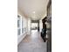 Bright entryway featuring neutral walls, tile flooring and bench with coat rack at 6491 Crestbrook Dr, Morrison, CO 80465