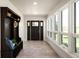 Welcoming foyer with coat rack bench seating and lots of natural light at 6491 Crestbrook Dr, Morrison, CO 80465