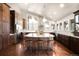 Spacious kitchen with a large island, stainless steel appliances, and hardwood floors at 6491 Crestbrook Dr, Morrison, CO 80465