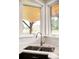 Stylish kitchen sink with view from window at 6491 Crestbrook Dr, Morrison, CO 80465