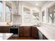 Well-lit kitchen features modern appliances, tile backsplash, and natural light at 6491 Crestbrook Dr, Morrison, CO 80465