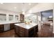 Open kitchen with an island, hardwood floors, and stainless steel appliances at 6491 Crestbrook Dr, Morrison, CO 80465