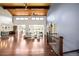 Spacious living room featuring hardwood floors, a stone fireplace, and soaring ceilings at 6491 Crestbrook Dr, Morrison, CO 80465