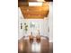 Bright living room with hardwood floors, skylight, and modern furniture at 6491 Crestbrook Dr, Morrison, CO 80465