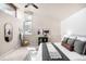 Bright bedroom with vaulted ceilings, brick accent wall, and large windows at 6491 Crestbrook Dr, Morrison, CO 80465