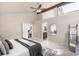 View of the main bedroom with ensuite bath access and ladder decor at 6491 Crestbrook Dr, Morrison, CO 80465
