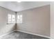 This bedroom features neutral walls, gray carpet, and bright windows, creating a cozy and inviting space at 808 Hanover St, Aurora, CO 80010