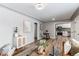 Open-concept living area showing modern decor and an open view into the renovated kitchen and dining area at 808 Hanover St, Aurora, CO 80010