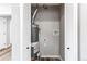 Water heater inside of a utility closet with white doors at 808 Hanover St, Aurora, CO 80010