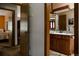 Traditional bathroom vanity featuring wooden cabinets and a granite countertop, blending classic design with functional elegance at 29101 Drexel Spur, Evergreen, CO 80439