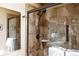 Shower features tiled walls, glass door, and modern fixtures providing a sleek and functional space at 29101 Drexel Spur, Evergreen, CO 80439