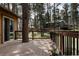 Spacious wooden deck overlooking a lush, tree-filled backyard, creating a serene and inviting outdoor living space at 29101 Drexel Spur, Evergreen, CO 80439