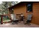 Inviting deck with comfortable chairs, perfect for enjoying the peaceful surroundings and outdoor relaxation at 29101 Drexel Spur, Evergreen, CO 80439