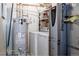 Utility room with washer, dryer, and water heater, efficiently designed for household needs at 29101 Drexel Spur, Evergreen, CO 80439