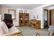 A comfortable room featuring a futon, built-in bookshelf, and a large window with natural light at 29101 Drexel Spur, Evergreen, CO 80439