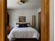 Comfortable bedroom featuring neutral tones, simple decor, and wood door frame at 29101 Drexel Spur, Evergreen, CO 80439