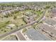 Aerial view of townhome community featuring a playground and green spaces at 12258 Hazel Spruce Ct, Parker, CO 80134