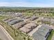 Aerial view showcasing community layout, nearby shopping, and panoramic mountain views at 12258 Hazel Spruce Ct, Parker, CO 80134