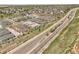 Drone shot shows residential area with new construction, manicured landscaping, and accessible roadways at 12258 Hazel Spruce Ct, Parker, CO 80134