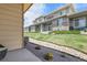 Exterior of townhouse featuring well maintained lawn and stone accents at 12258 Hazel Spruce Ct, Parker, CO 80134