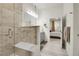 Beautiful bathroom with a glass shower, a large mirror, and access to a bedroom at 12258 Hazel Spruce Ct, Parker, CO 80134