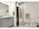Well-appointed bathroom featuring a shower, marble countertop vanity, and modern toilet at 12258 Hazel Spruce Ct, Parker, CO 80134