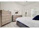 Spacious bedroom with elegant furnishings and light wood floors at 12258 Hazel Spruce Ct, Parker, CO 80134