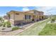 Exterior side view of home with stone accents and landscaping at 12258 Hazel Spruce Ct, Parker, CO 80134