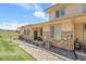 Side view of home featuring manicured lawn and stone accents at 12258 Hazel Spruce Ct, Parker, CO 80134