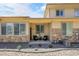 Front exterior featuring a covered patio with stylish seating at 12258 Hazel Spruce Ct, Parker, CO 80134