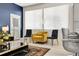 Cozy seating area near a window offering natural light and modern decor at 12258 Hazel Spruce Ct, Parker, CO 80134