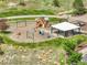 Community playground with swings, slides, and a picnic shelter, perfect for Gathering fun at 12258 Hazel Spruce Ct, Parker, CO 80134