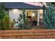 Backyard patio with a privacy fence, outdoor seating area, and sliding glass doors to the house at 6303 E Dakota Ave, Denver, CO 80224