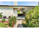 Charming home featuring a landscaped yard with a covered patio, perfect for outdoor living at 6303 E Dakota Ave, Denver, CO 80224