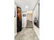 Carpeted basement stairs leading to the lower level, decorated with boat-themed artwork at 6303 E Dakota Ave, Denver, CO 80224