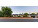 Charming single-story home with solar panels, an attached garage and a well-maintained front yard at 6303 E Dakota Ave, Denver, CO 80224