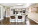 Modern kitchen with a granite island, stainless steel appliances, and stylish bar stools, perfect for cooking at 6303 E Dakota Ave, Denver, CO 80224