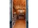 Wood-paneled wine cellar has custom brick wine racks and display shelves at 6303 E Dakota Ave, Denver, CO 80224
