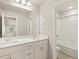 Double vanity bathroom with white cabinets and bathtub at 9137 Pitkin St, Commerce City, CO 80022