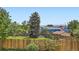 Large fenced in backyard with mature trees at 8897 Wagner Ln, Westminster, CO 80031