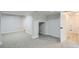 Finished basement rec room with new carpet and doorway to the rest of the house at 8897 Wagner Ln, Westminster, CO 80031