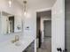 Bright bathroom featuring quartz countertop, modern vanity, and stylish lighting at 8897 Wagner Ln, Westminster, CO 80031