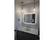 Bright bathroom with a modern mirror, fixtures, and soft lighting at 8897 Wagner Ln, Westminster, CO 80031
