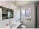 Updated bathroom featuring a modern vanity, stylish fixtures, and shower with glass door at 8897 Wagner Ln, Westminster, CO 80031