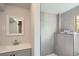 Updated bathroom featuring new tiles in the shower and updated vanity with mirror at 8897 Wagner Ln, Westminster, CO 80031